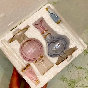 Iridescent glass perfume bottles